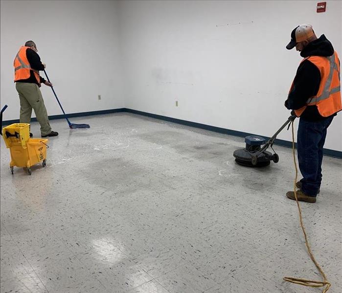 SERVPRO employees waxing a VCT tile floor