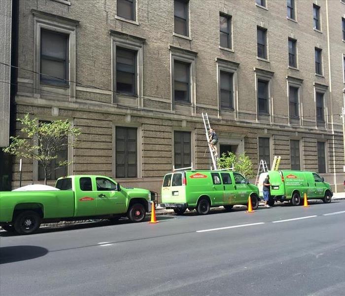SERVPRO trucks lined up min front of a large building in Honesdale