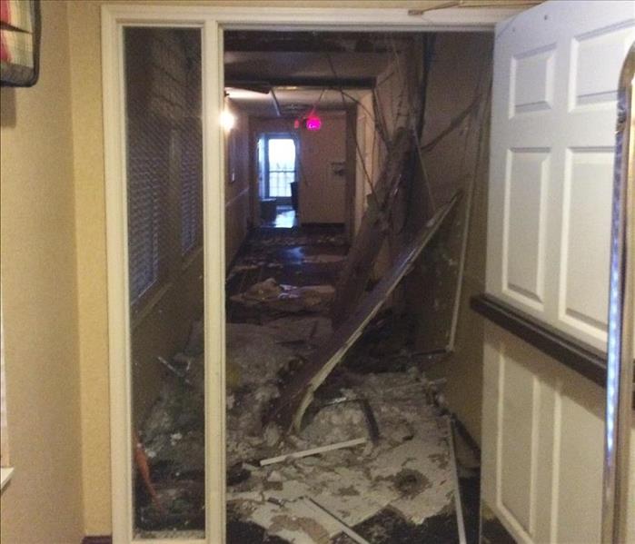 Fallen ceiling tiles laying on the floor a of local hotel. They fell due to a broken ceiling pipe.