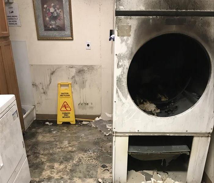 Picture of a fire damaged dryer from a Scranton laundromat